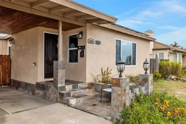a front view of a house with garden