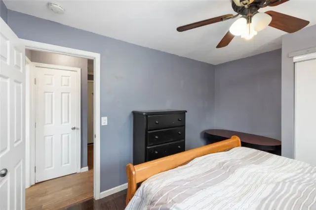 a bedroom with a bed and a closet