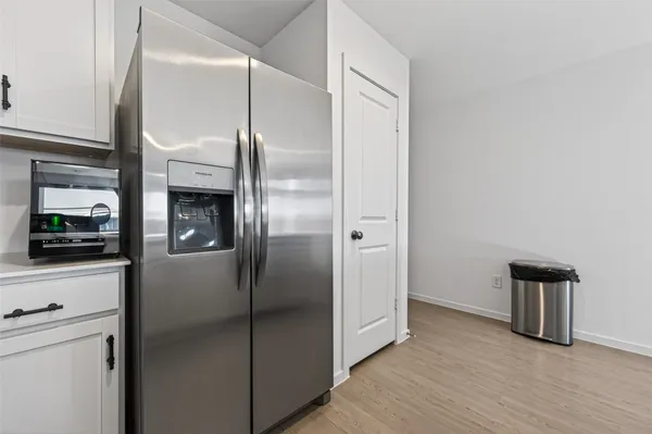 a kitchen with stainless steel appliances a refrigerator and a stove