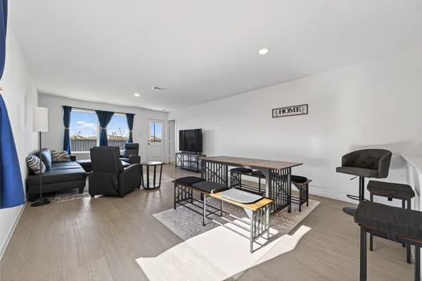 a living room with furniture and a rug