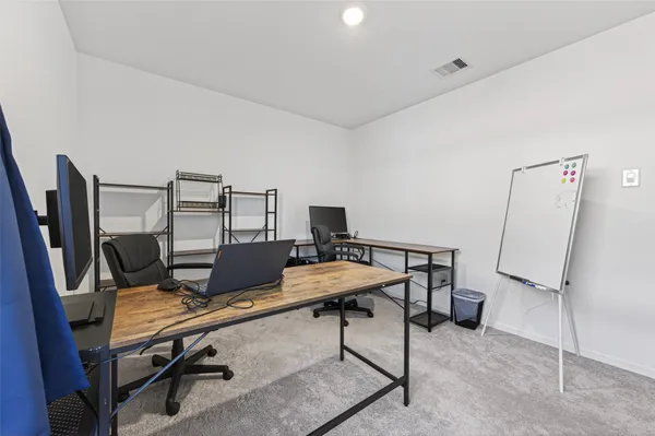 a view of a workspace with furniture