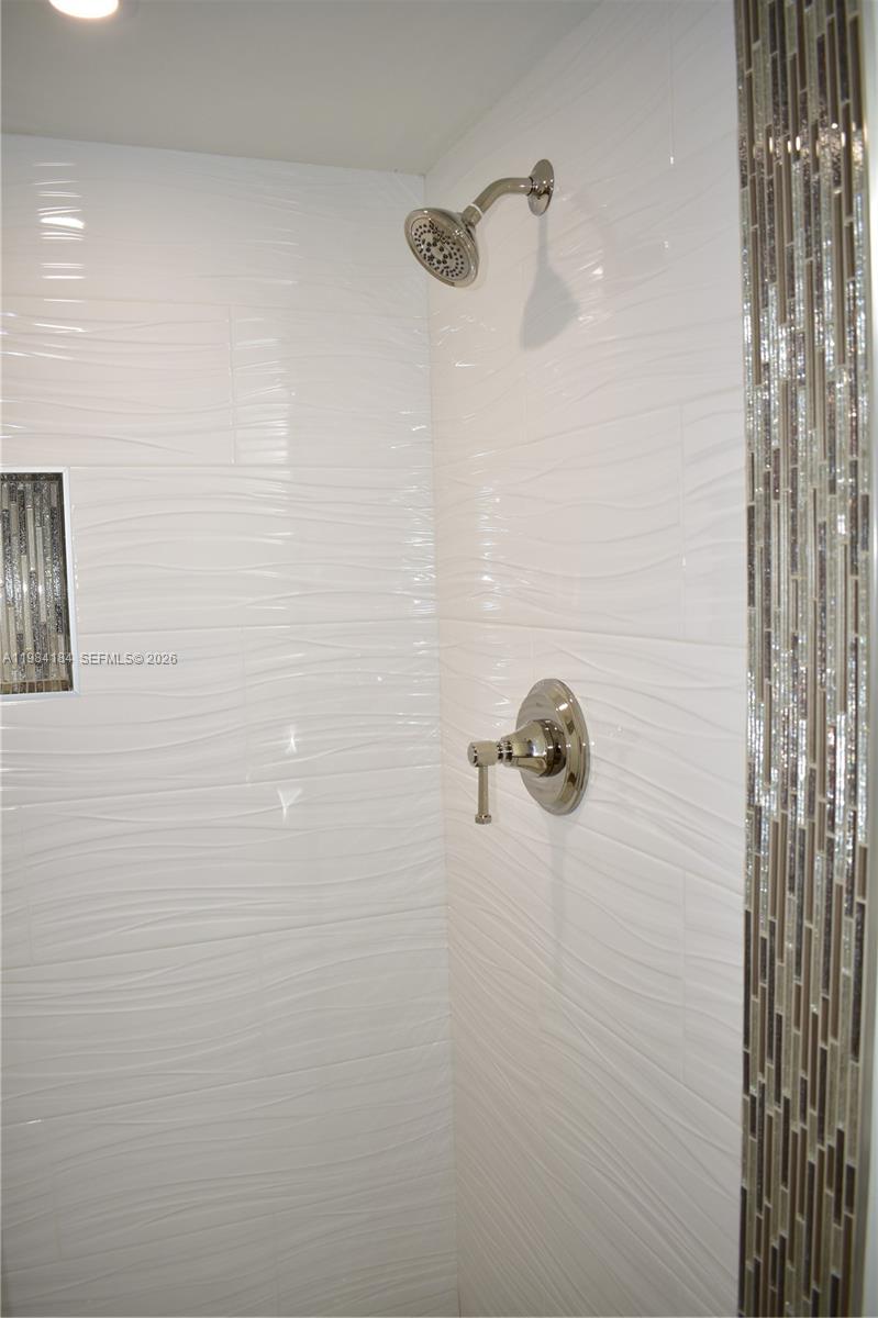 8846 West McNab Road, Unit 106 Tamarac, FL 33321 - Photo 6 of 39 Guest Bathroom