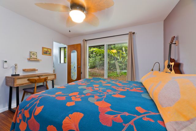 a bedroom with a bed and a table