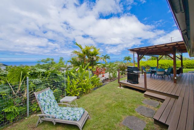 a view of a chairs and table in the patio