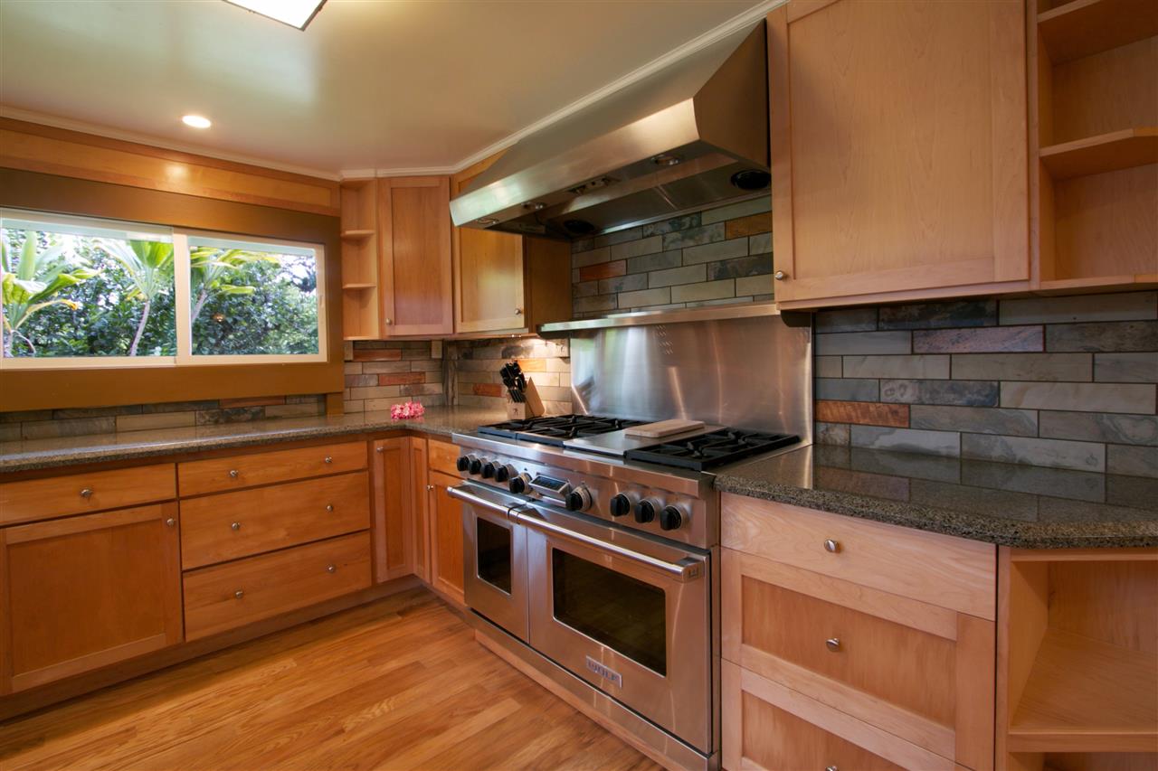 261 Awalau Road Haiku, HI 96708 - Photo 3 of 29 a kitchen with stainless steel appliances granite countertop a stove and a sink
