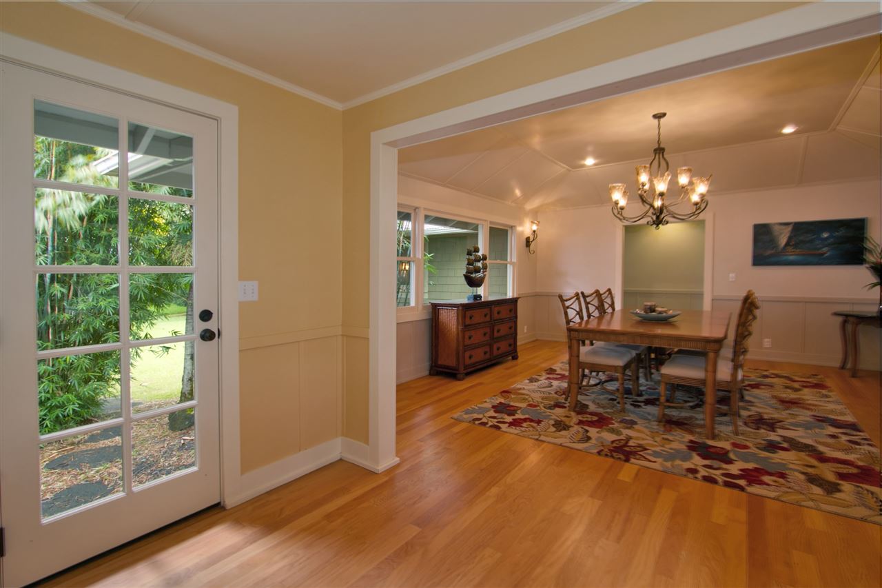 261 Awalau Road Haiku, HI 96708 - Photo 8 of 29 a living room with furniture and a chandelier