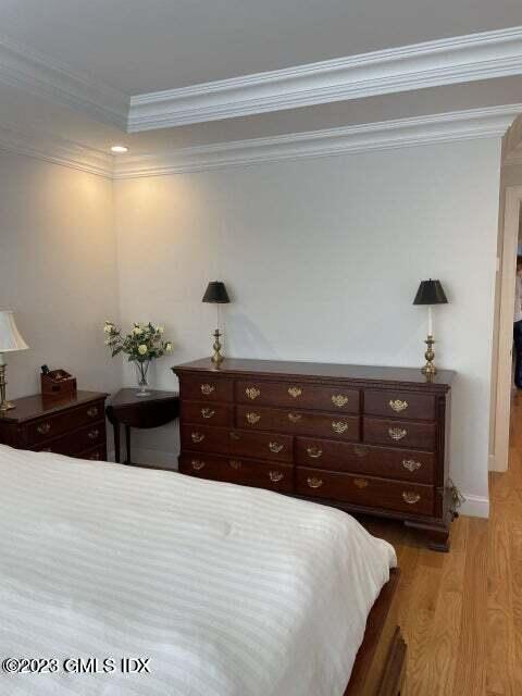 8 Sound Beach Ave Extension, Unit 1 Riverside, CT 06878 - Photo 11 of 31 a bedroom with a bed and a dresser