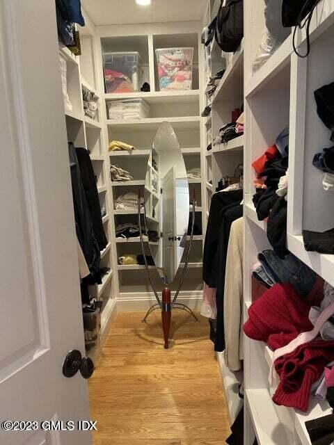 8 Sound Beach Ave Extension, Unit 1 Riverside, CT 06878 - Photo 14 of 31 a view of walk in closet with clothes and shoes