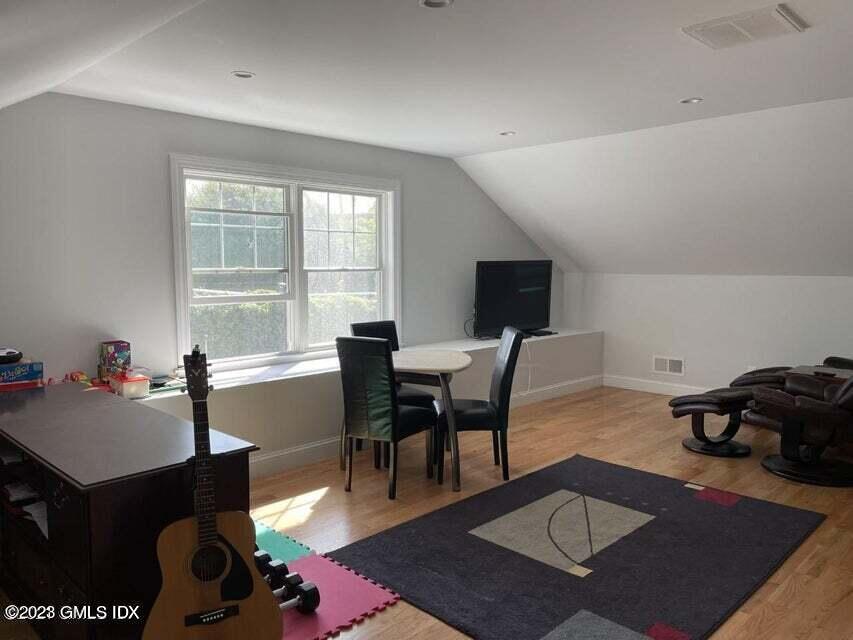 8 Sound Beach Ave Extension, Unit 1 Riverside, CT 06878 - Photo 20 of 31 a living room with furniture a rug and a table