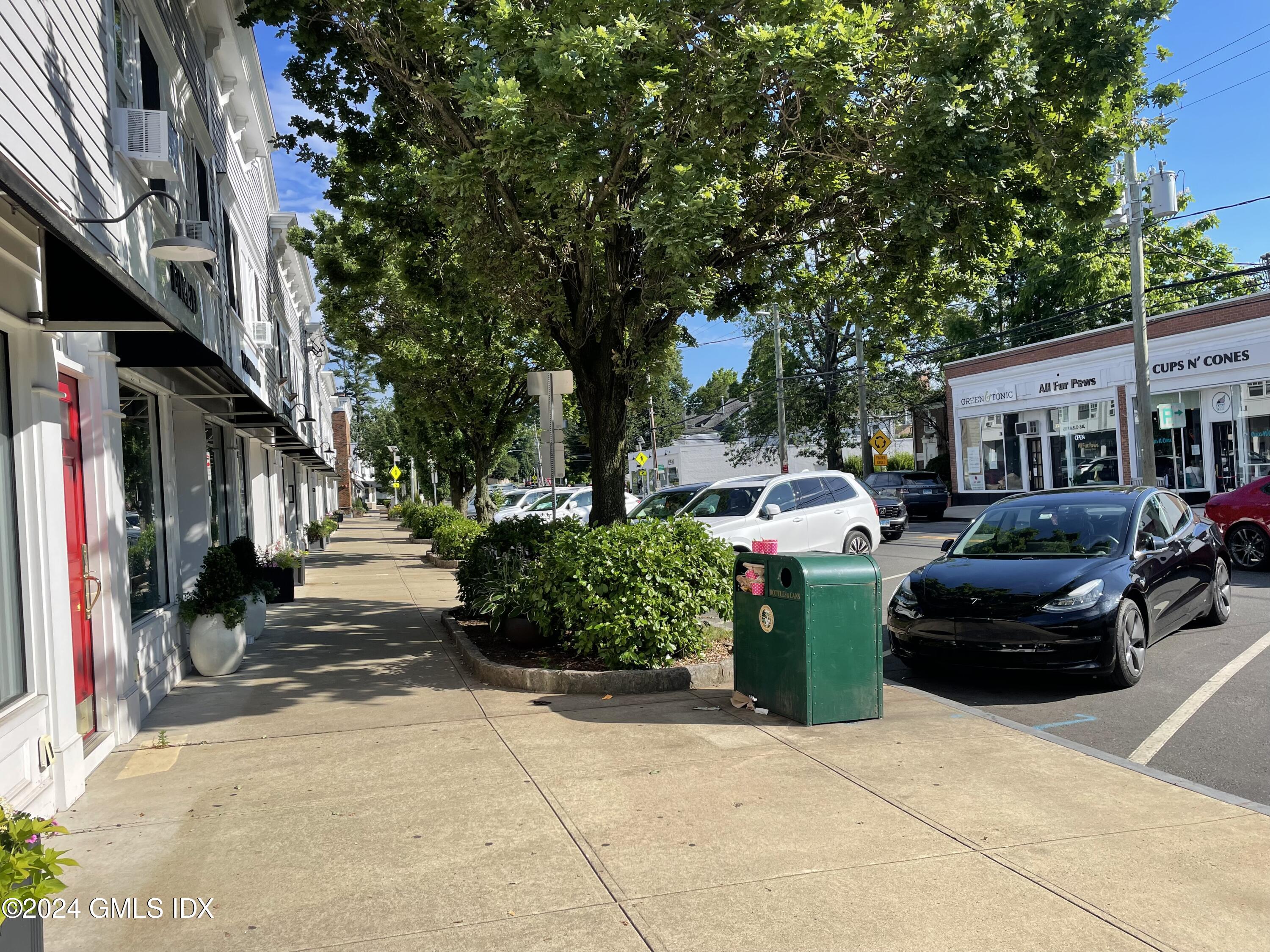 8 Sound Beach Ave Extension, Unit 1 Riverside, CT 06878 - Photo 26 of 31 a car parked in front of a building
