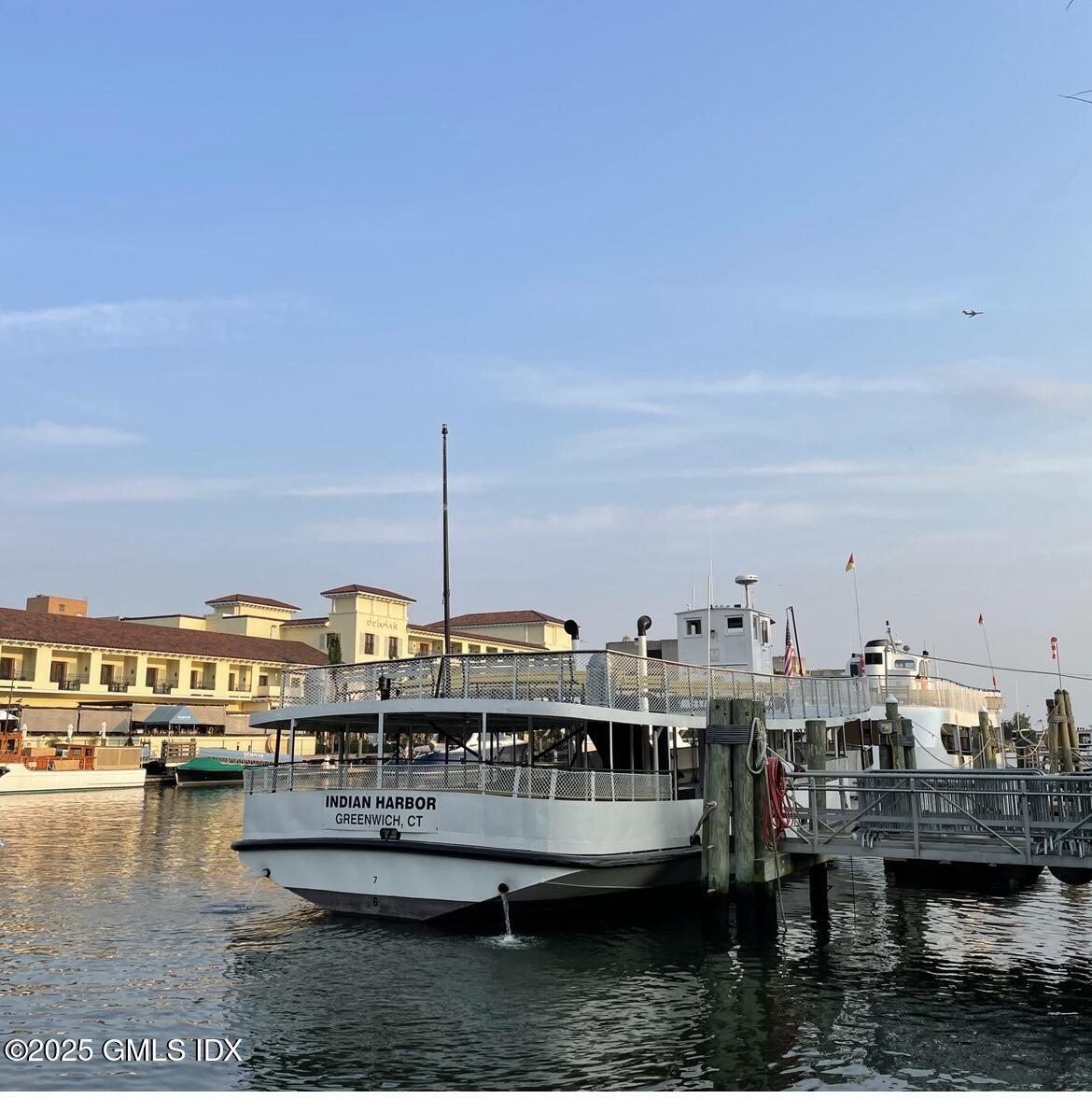 8 Sound Beach Ave Extension, Unit 1 Riverside, CT 06878 - Photo 27 of 31 a view of a lake with boats and trees in the background