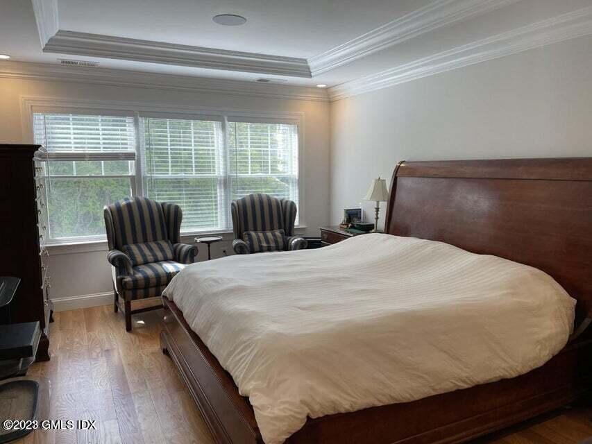 8 Sound Beach Ave Extension, Unit 1 Riverside, CT 06878 - Photo 10 of 31 a bed sitting in a bedroom next to a window