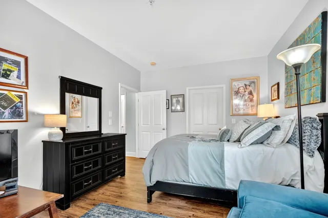 a bedroom with a bed and a television