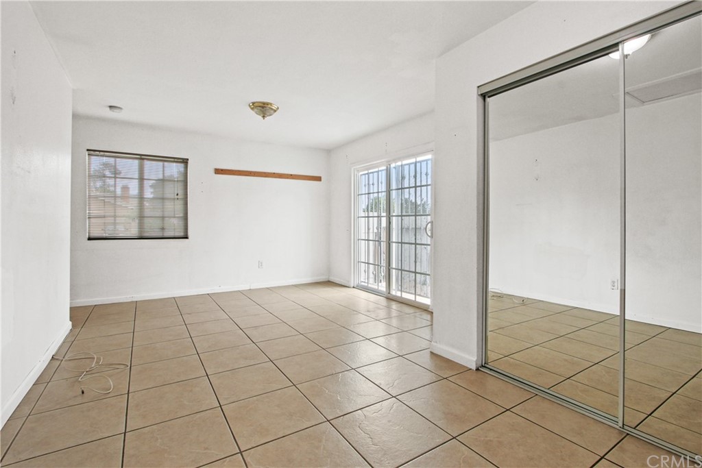 3655 Webster Avenue Long Beach, CA 90810 - Photo 11 of 22 a view of an empty room with glass door