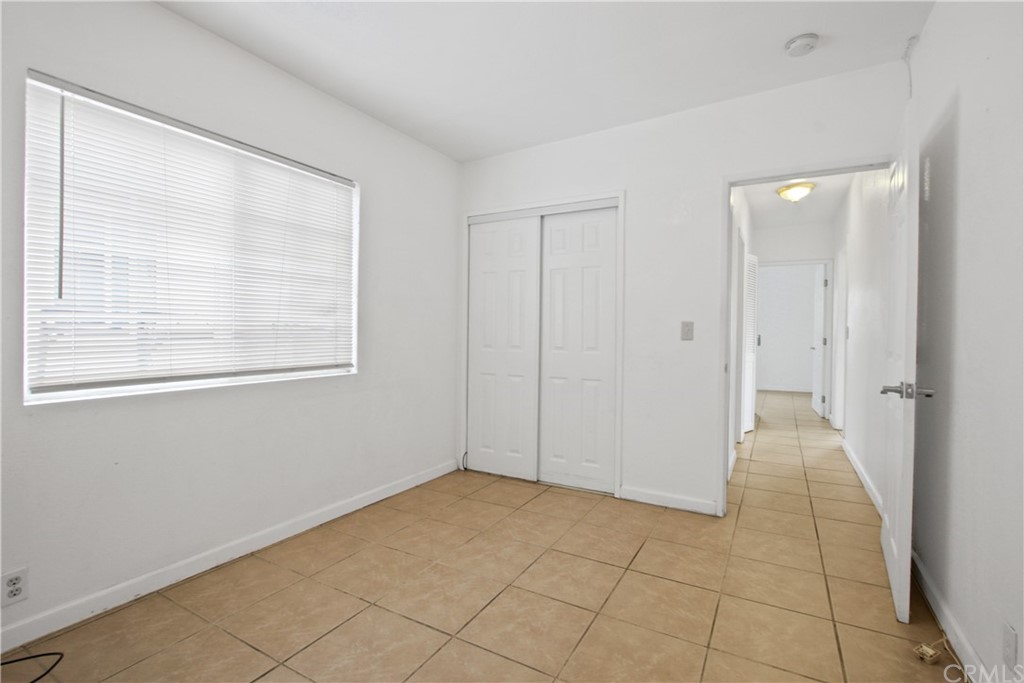 3655 Webster Avenue Long Beach, CA 90810 - Photo 15 of 22 a view of an empty room with a window