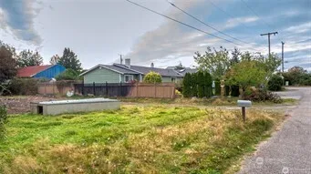 a swimming pool with outdoor seating and yard