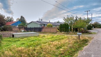 1361 Peltier Drive Point Roberts, WA 98281 - Photo 1 of 11 a swimming pool with outdoor seating and yard