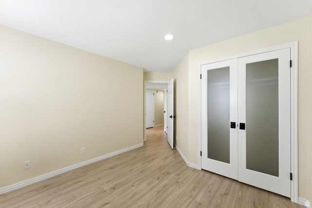 1041 West Grindelwald Court, Unit R5 Midway, UT 84049 - Photo 21 of 44 Bedroom featuring light wood-style flooring, french doors, a closet, and recessed lighting. Flexible layout allows for different furniture arrangements to suit your needs.