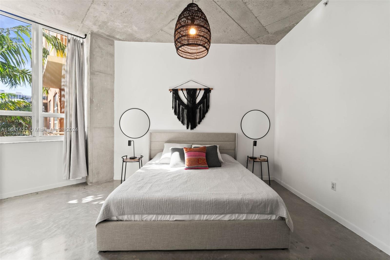 2001 Biscayne Boulevard, Unit 2409 Miami, FL 33137 - Photo 13 of 29 a bedroom with a bed and a window