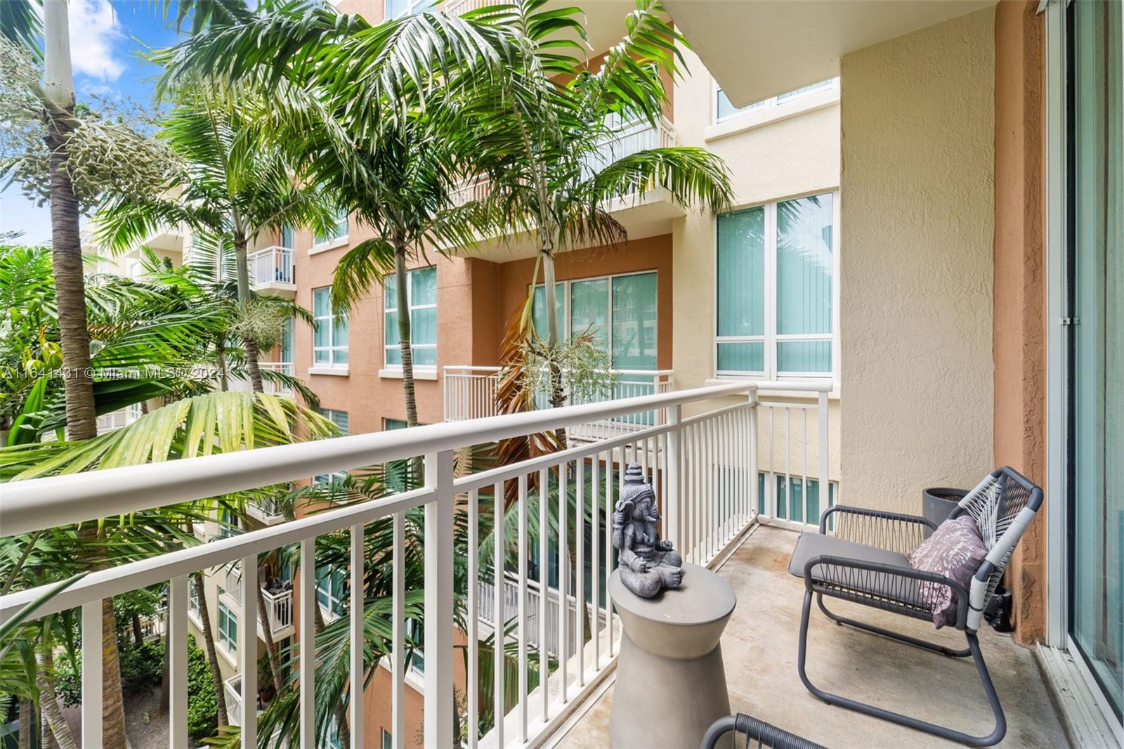 2001 Biscayne Boulevard, Unit 2409 Miami, FL 33137 - Photo 18 of 29 a view of a patio with couches table and chairs and potted plants
