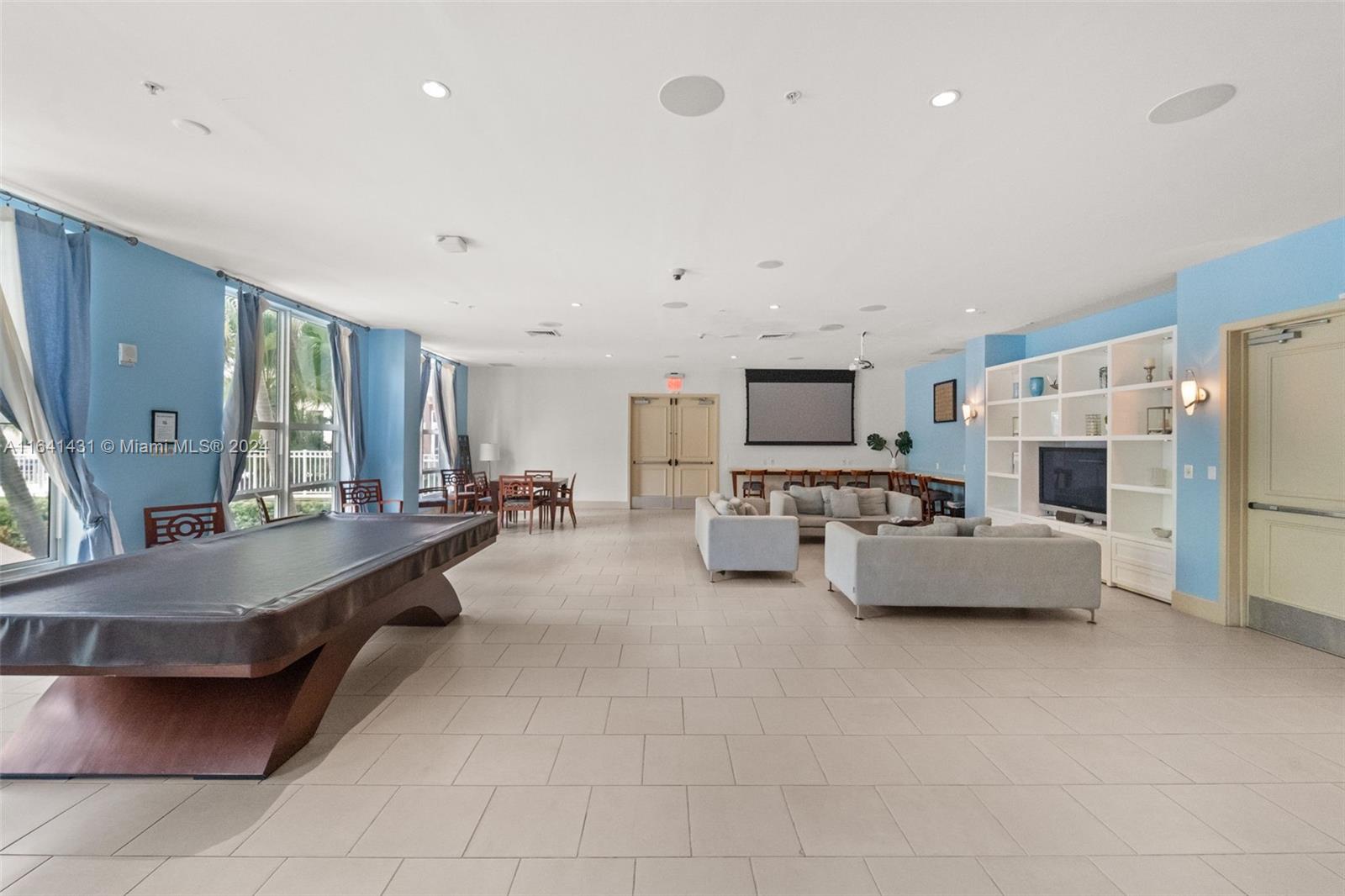 2001 Biscayne Boulevard, Unit 2409 Miami, FL 33137 - Photo 22 of 29 a large room with a large bed and furniture