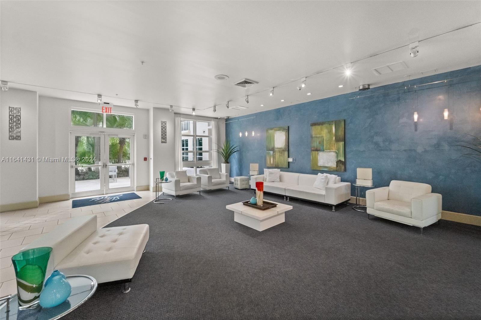 2001 Biscayne Boulevard, Unit 2409 Miami, FL 33137 - Photo 23 of 29 a living room with furniture and floor to ceiling window