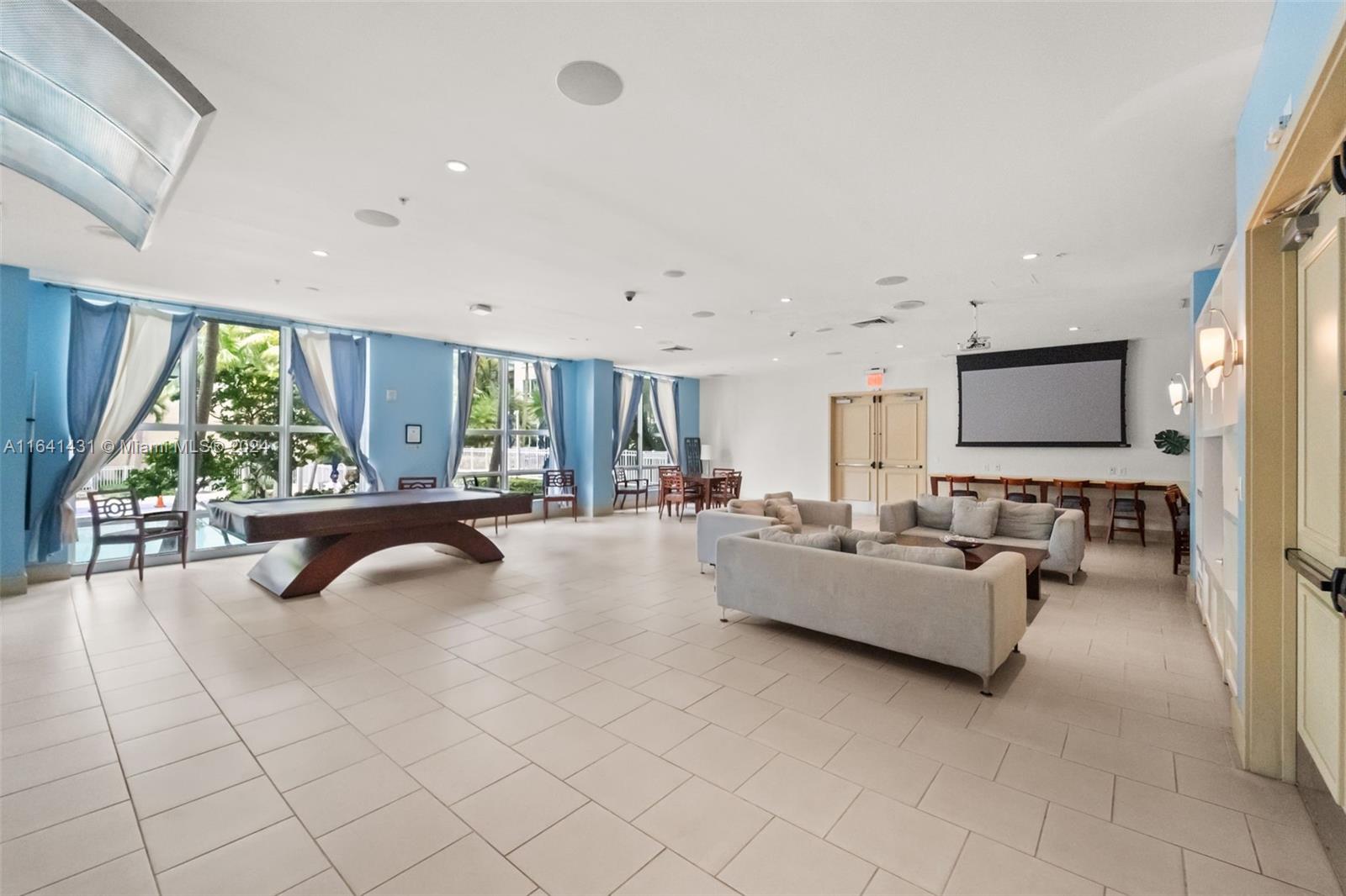 2001 Biscayne Boulevard, Unit 2409 Miami, FL 33137 - Photo 24 of 29 a living room with furniture and a flat screen tv