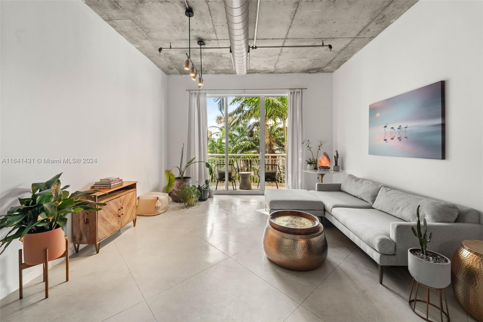 2001 Biscayne Boulevard, Unit 2409 Miami, FL 33137 - Photo 3 of 29 a living room with furniture and a large window