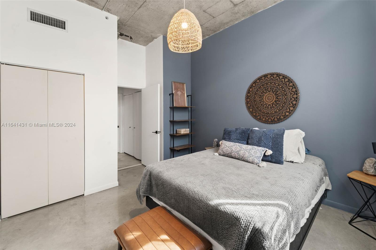 2001 Biscayne Boulevard, Unit 2409 Miami, FL 33137 - Photo 8 of 29 a bedroom with a bed and a table