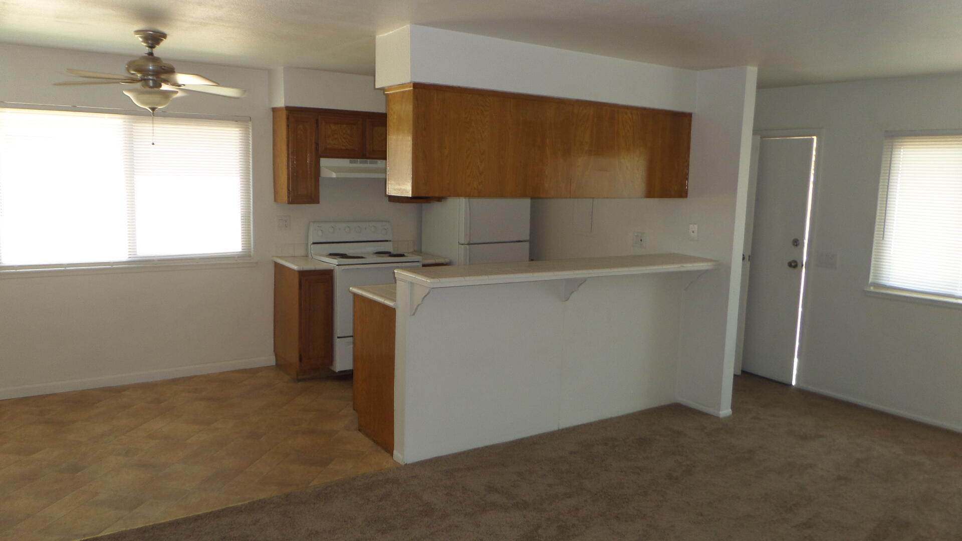 a view of a kitchen with a sink cabinet and a window