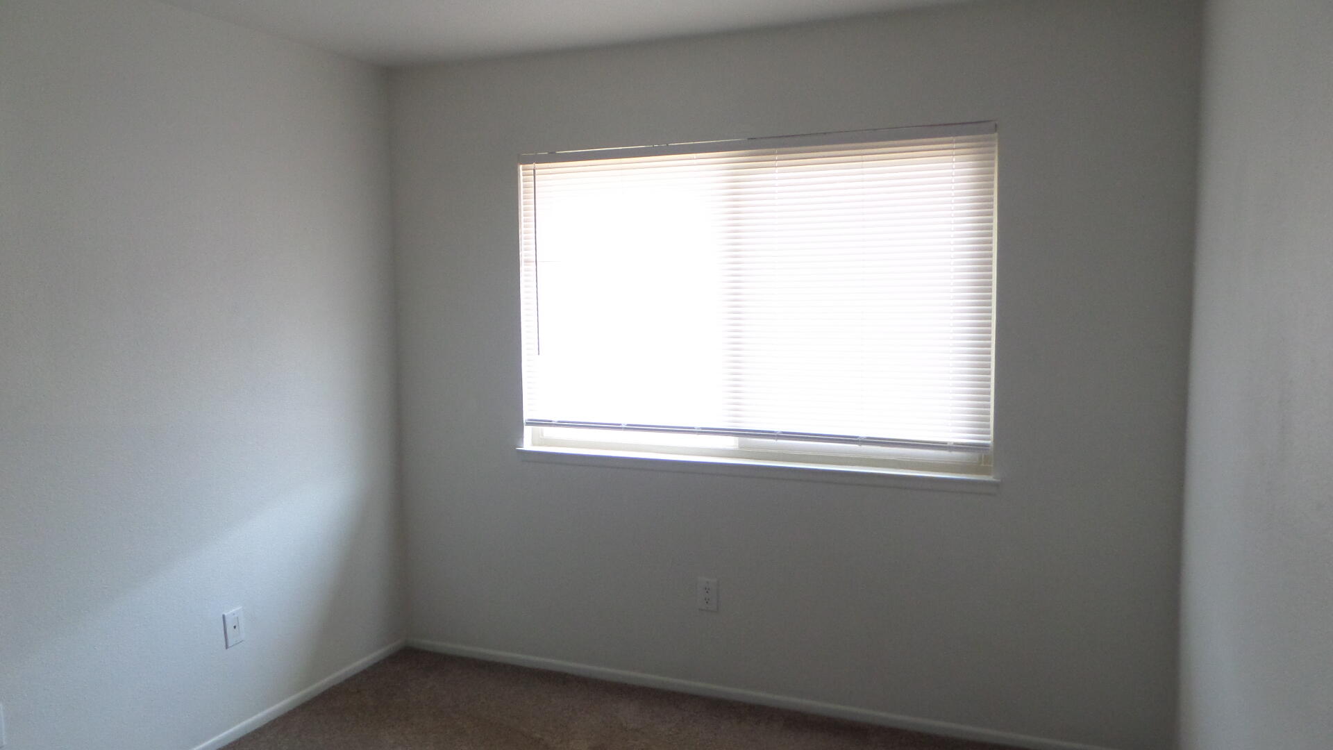72631 Thrush Road, Unit 4 Palm Desert, CA 92260 - Photo 14 of 24 an empty room with a window
