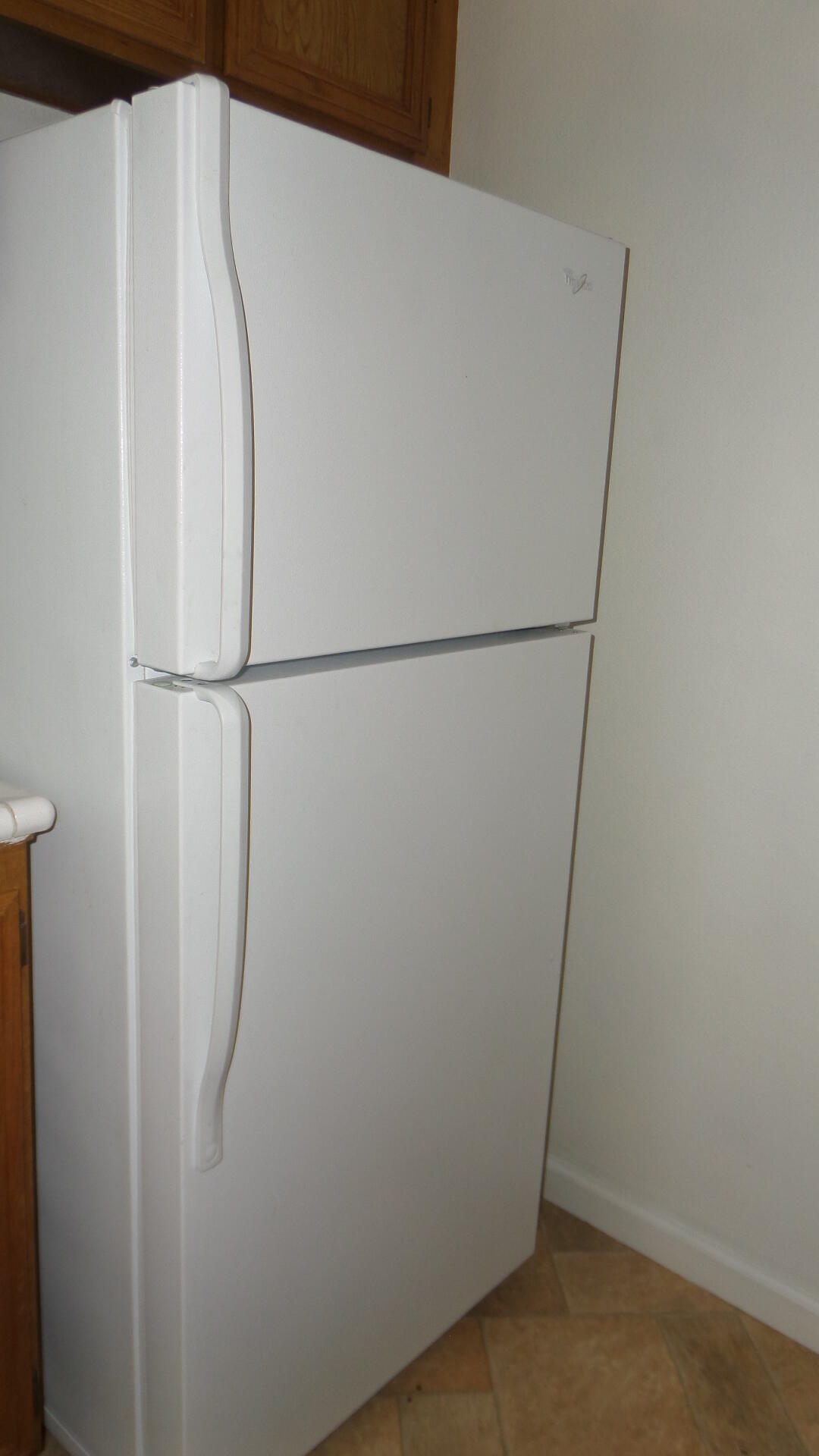 72631 Thrush Road, Unit 4 Palm Desert, CA 92260 - Photo 6 of 24 a white refrigerator freezer sitting next to a white wall