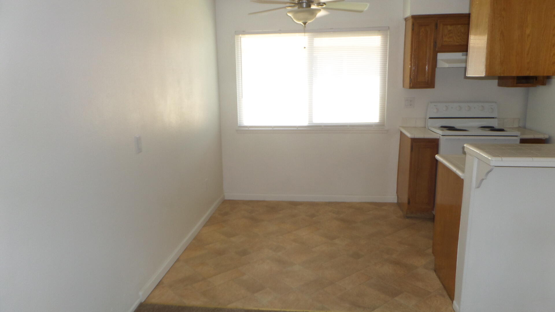 72631 Thrush Road, Unit 4 Palm Desert, CA 92260 - Photo 8 of 24 a view of a kitchen with a sink cabinet and a window