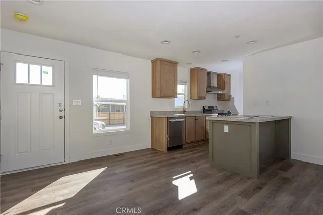 a kitchen with a sink cabinets and window