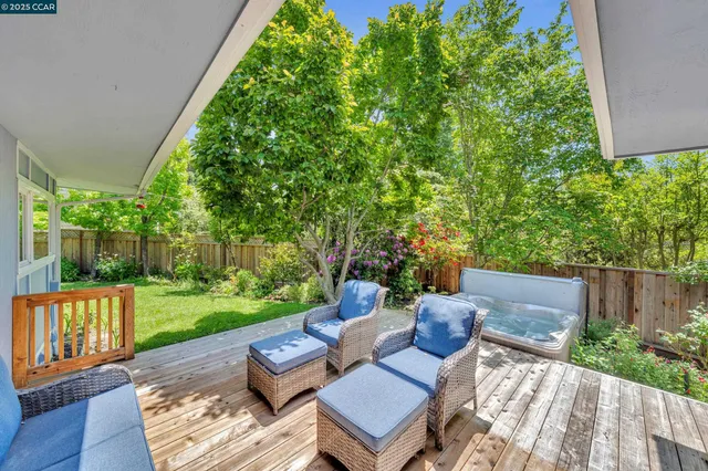 a view of a yard with furniture and garden
