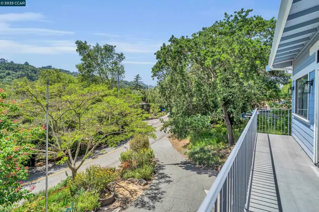 a view of balcony with yard