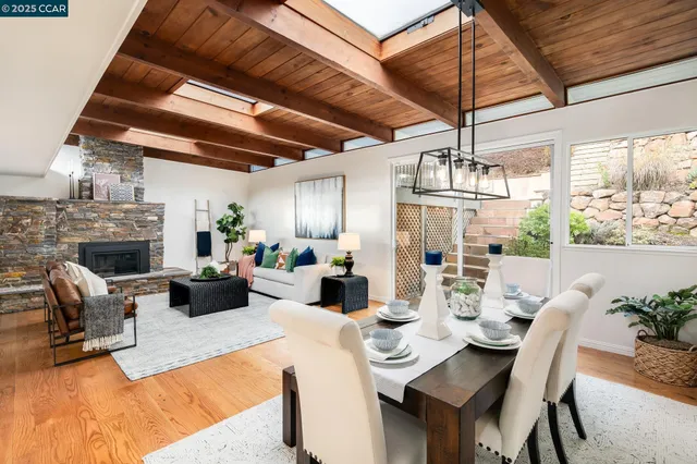 a view of a dining room with furniture window and outside view