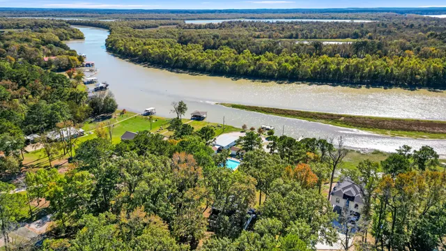 an aerial view of a house with a lake view
