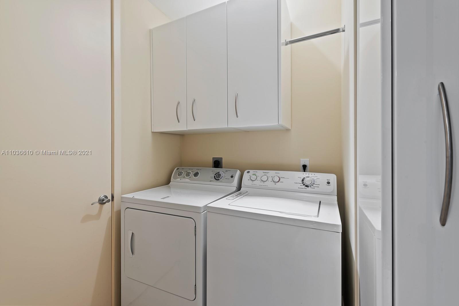 218 Southeast 14th Street, Unit TS103 Miami, FL 33131 - Photo 18 of 31 a utility room with dryer and washer
