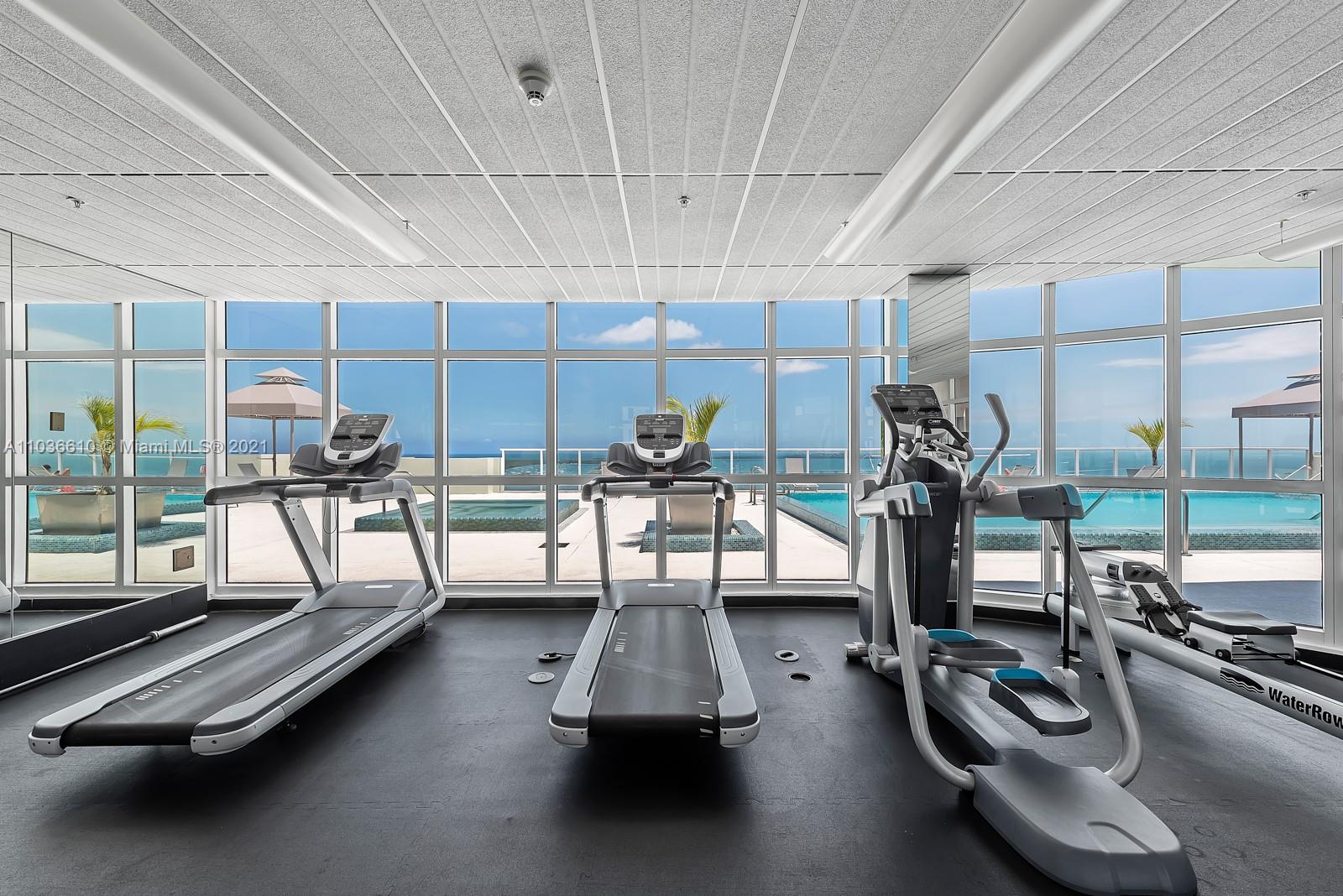 218 Southeast 14th Street, Unit TS103 Miami, FL 33131 - Photo 21 of 31 a view of a room with gym equipment