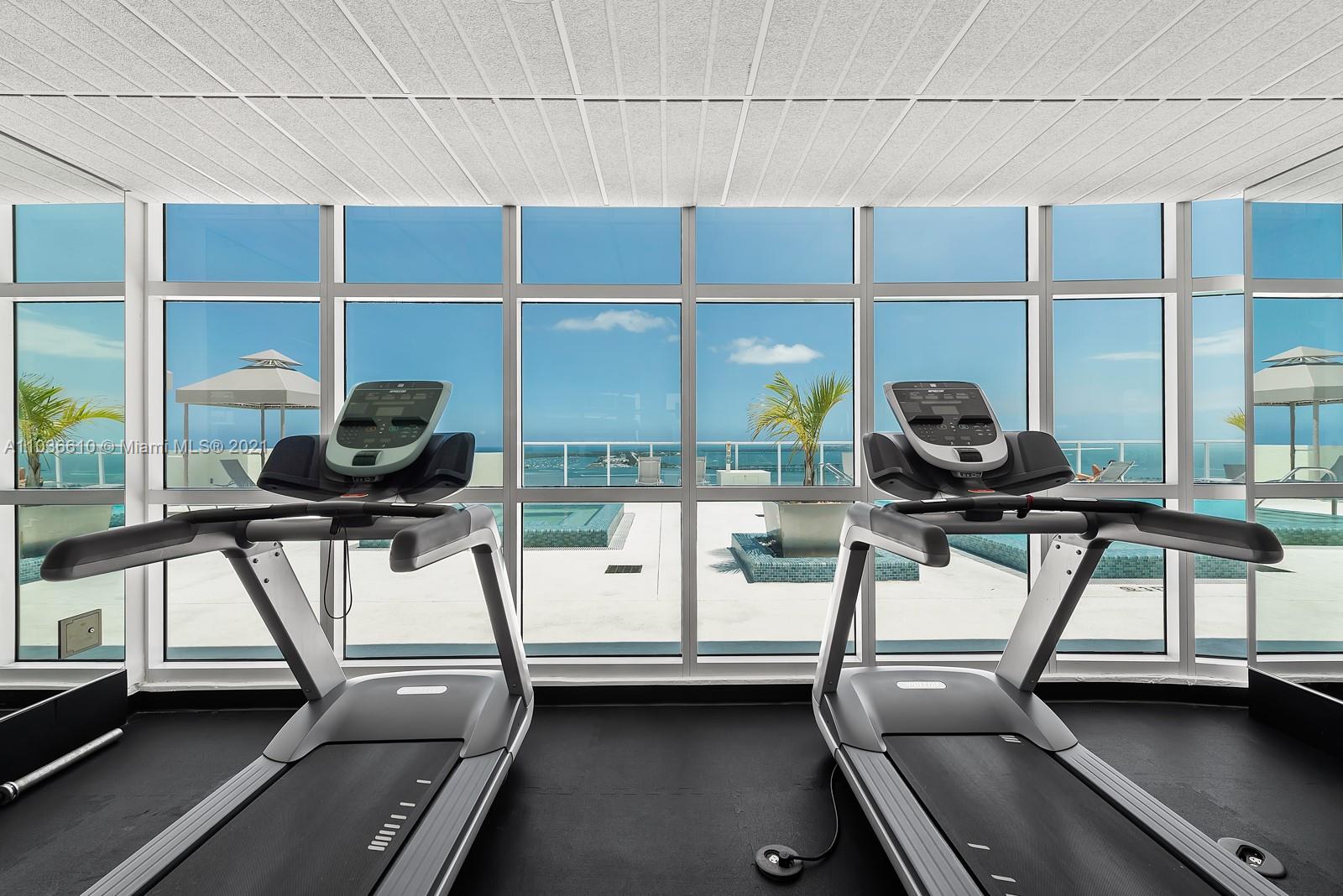 218 Southeast 14th Street, Unit TS103 Miami, FL 33131 - Photo 22 of 31 a room with gym equipment