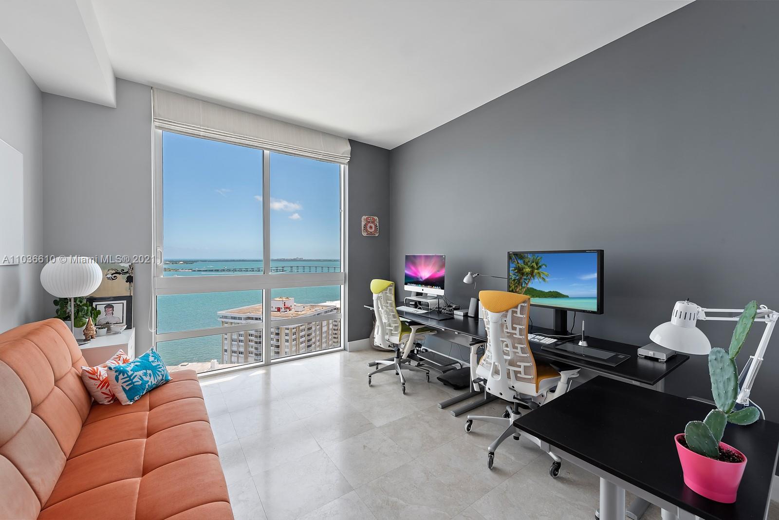 218 Southeast 14th Street, Unit TS103 Miami, FL 33131 - Photo 10 of 31 a work room with furniture and a potted plant
