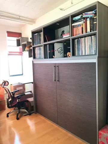 a workspace room with furniture