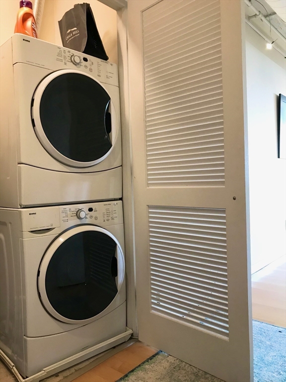 210 South Street, Unit 104 Boston, MA 02111 - Photo 20 of 24 a utility room with dryer and washer