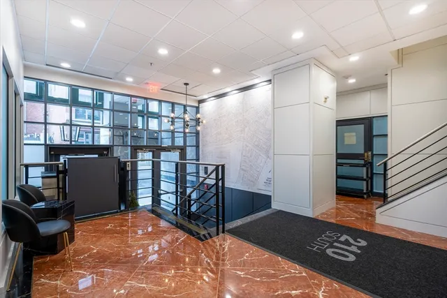 a view of a hallway with seating area