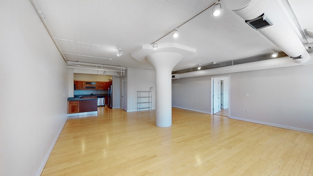 210 South Street, Unit 104 Boston, MA 02111 - Photo 3 of 24 an empty room with windows