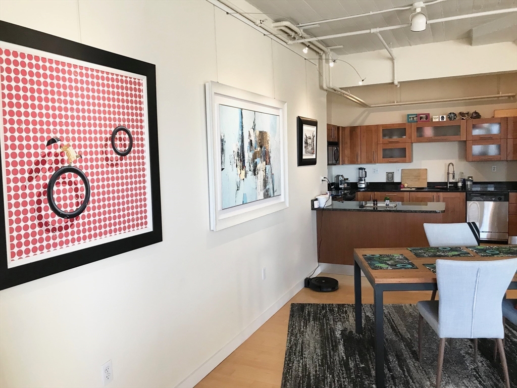 210 South Street, Unit 104 Boston, MA 02111 - Photo 8 of 24 a view of a kitchen with granite countertop lots of counter top space