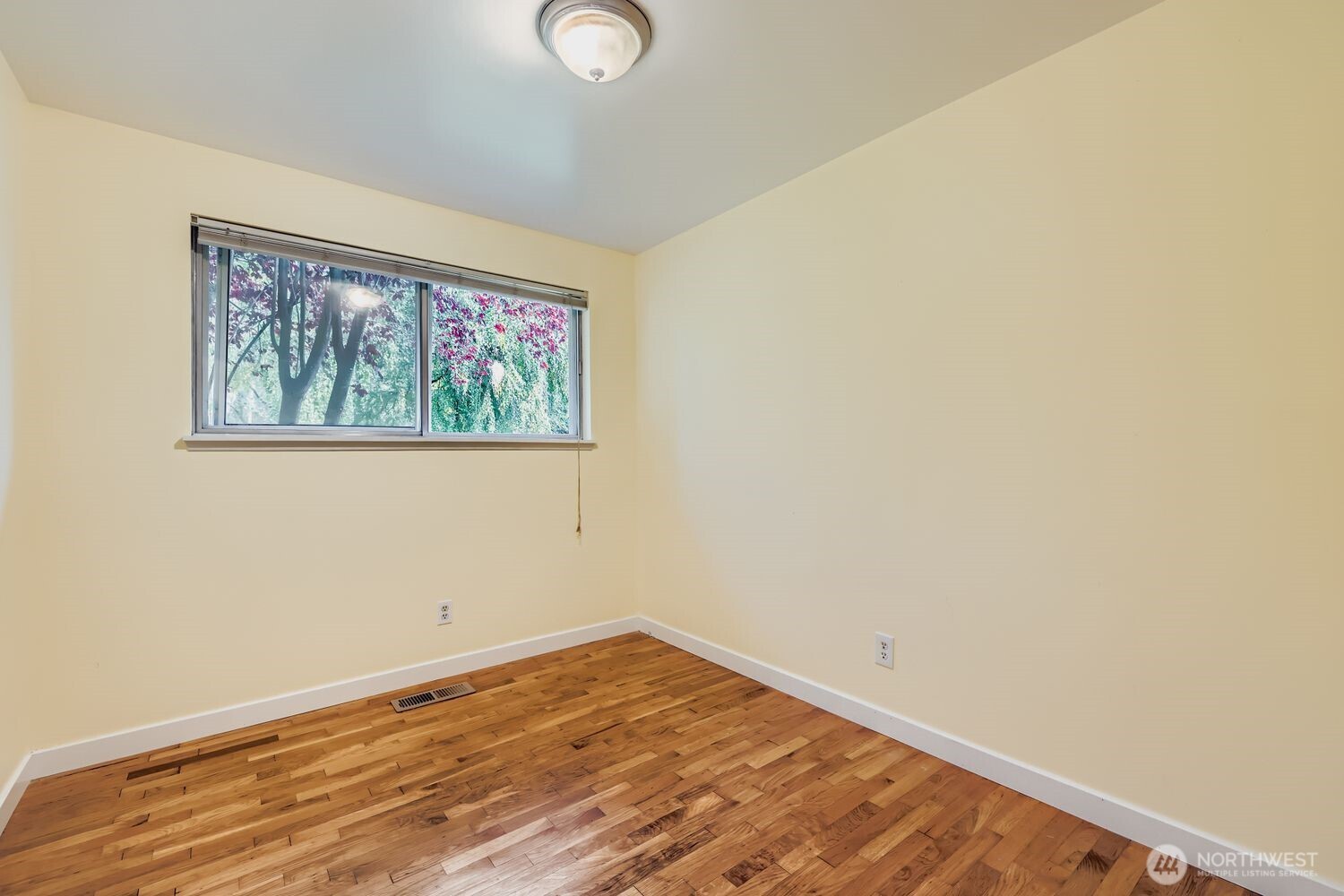 5031 158th Street Southwest Edmonds, WA 98026 - Photo 13 of 17 a view of empty room with wooden floor
