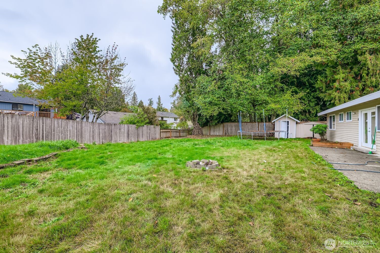 5031 158th Street Southwest Edmonds, WA 98026 - Photo 16 of 17 a front view of a house with garden