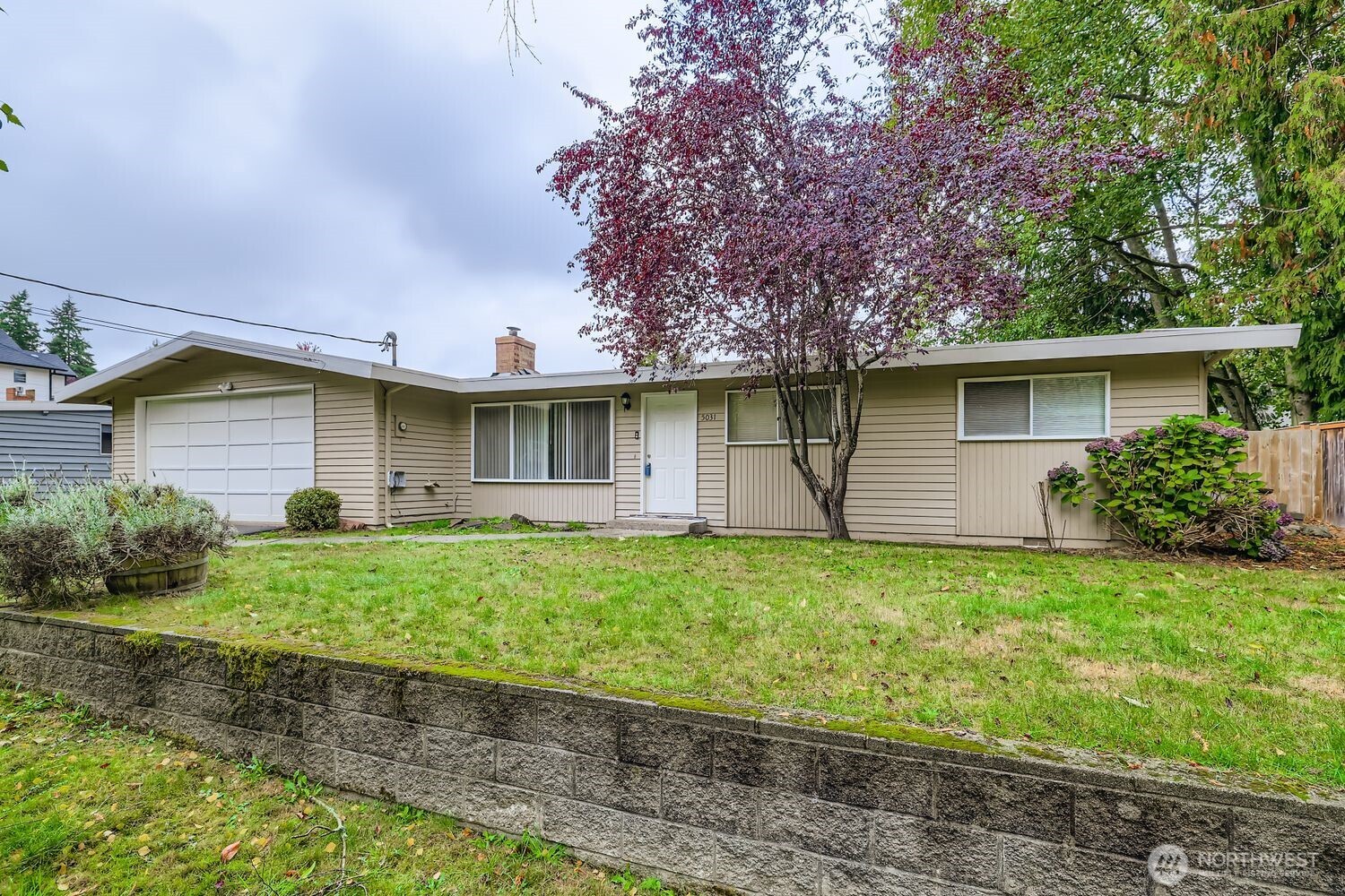5031 158th Street Southwest Edmonds, WA 98026 - Photo 2 of 17 a front view of a house with garden